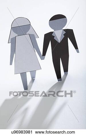 Stock Image - Paper wedding figurines, studio shot. Fotosearch