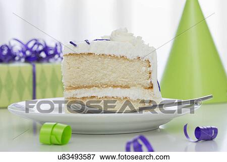 Piece of birthday cake on plate View Large Photo Image Stock Photo - Piece of birthday cake on plate. Fotosearch