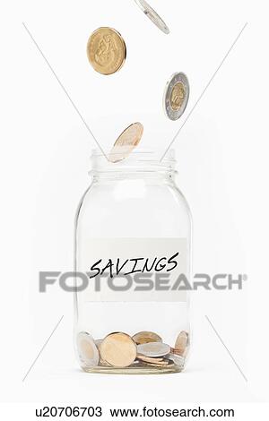 Stock Image - Piggybank with falling coins. Fotosearch