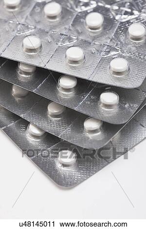 Stock Image - Pills in blister packs, studio shot. Fotosearch