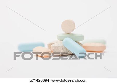Picture - Pills on white background, studio shot. Fotosearch