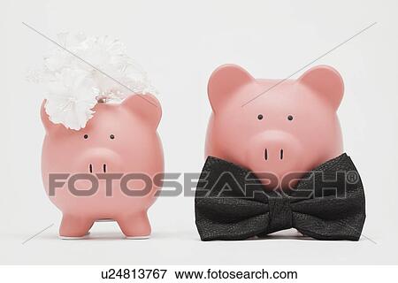 Pink piggybanks stylized as wedding couple, studio shot View Large Photo Image Stock Photo - Pink piggybanks stylized as wedding couple, studio shot. Fotosearch