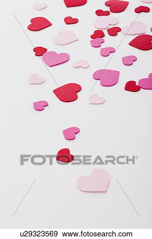 Stock Photo - Pink, red and white hearts on white background. Fotosearch