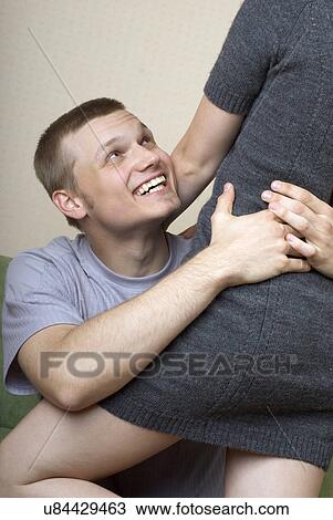 Stock Image - Playful young couple embracing. Fotosearch