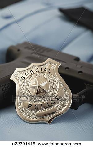 Police badge and gun View Large Photo Image Stock Photography - Police badge and gun. Fotosearch