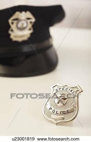 Police badge and hat View Large Photo Image Stock Photo - Police badge and hat. Fotosearch