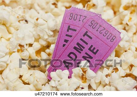 Popcorn with movie tickets View Large Photo Image Picture - Popcorn with movie tickets. Fotosearch