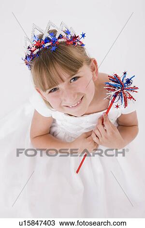 Stock Image - Portrait of girl (8-9) wearing Fourth of July costume. Fotosearch