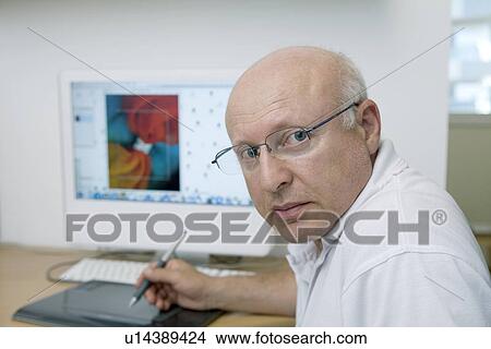 Picture - Portrait of graphic designer working on computer. Fotosearch
