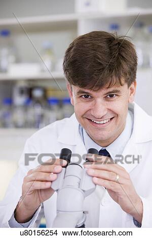 Portrait of mid adult scientist View Large Photo Image Picture - Portrait of mid adult scientist. Fotosearch