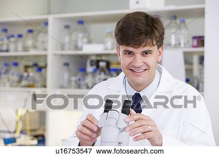 Stock Photo - Portrait of mid adult scientist. Fotosearch