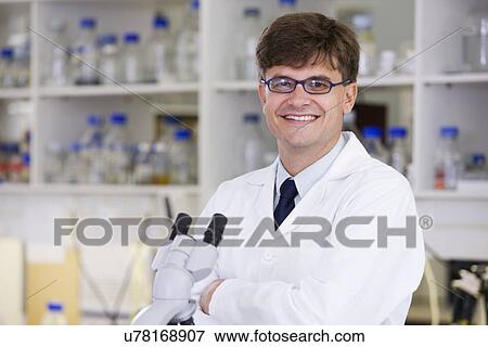 Stock Photo - Portrait of mid adult scientist. Fotosearch