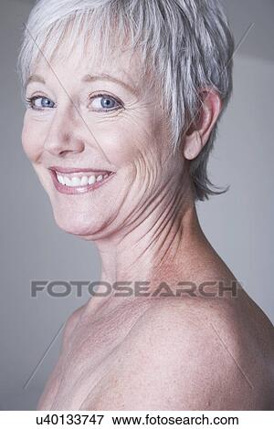 Portrait of smiling mature woman View Large Photo Image Stock Photo - Portrait of smiling mature woman. Fotosearch