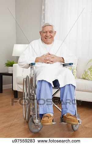 Stock Image - Portrait of smiling senior man on wheelchair. Fotosearch
