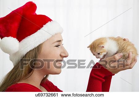 Portrait of teenage girl (14-15) holding kitten View Large Photo Image Stock Image - Portrait of teenage girl (14-15) holding kitten. Fotosearch