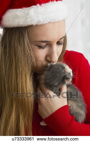 Portrait of teenage girl (14-15) holding kitten View Large Photo Image Stock Image - Portrait of teenage girl (14-15) holding kitten. Fotosearch