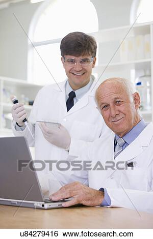 Stock Photograph - Portrait of two male scientists. Fotosearch
