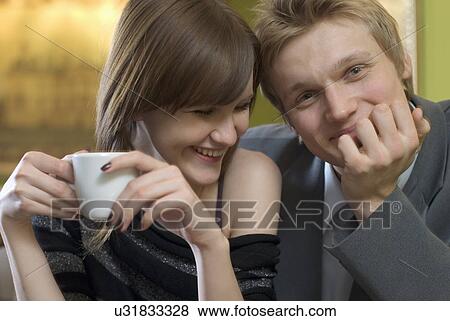 Portrait of young couple in cafe View Large Photo Image Stock Photo - Portrait of young couple in cafe. Fotosearch