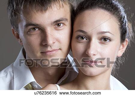 Stock Photograph - Portrait of young couple. Fotosearch
