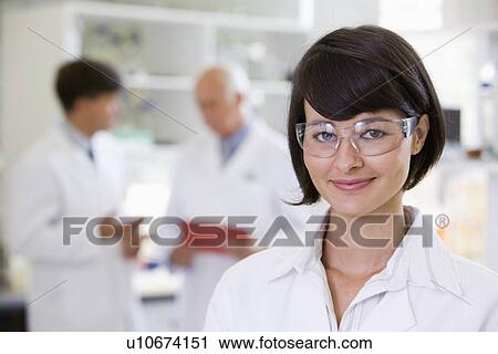 Stock Image - Portrait of young female scientist. Fotosearch