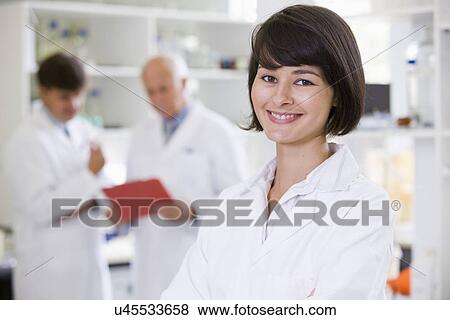 Stock Photo - Portrait of young female scientist. Fotosearch