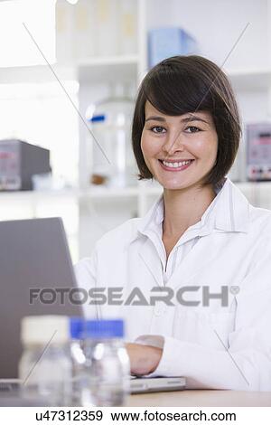 Portrait of young female scientist View Large Photo Image Stock Photo - Portrait of young female scientist. Fotosearch