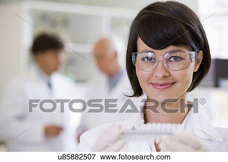 Portrait of young female scientist View Large Photo Image Stock Photo - Portrait of young female scientist. Fotosearch