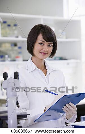 Portrait of young female scientist View Large Photo Image Stock Photo - Portrait of young female scientist. Fotosearch