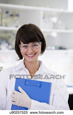 Stock Photography - Portrait of young female scientist. Fotosearch