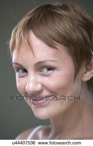 Portrait of young smiling woman View Large Photo Image Stock Photograph - Portrait of young smiling woman. Fotosearch