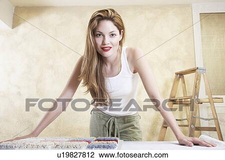 Portrait of young woman with carpet samples View Large Photo Image Stock Image - Portrait of young woman with carpet samples. Fotosearch