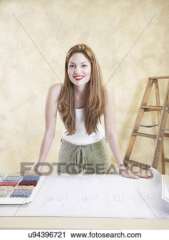 Portrait of young woman with carpet samples View Large Photo Image Stock Image - Portrait of young woman with carpet samples. Fotosearch