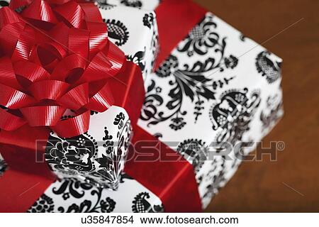 Picture - Presents wrapped in wrapping paper with damask pattern, high angle view. Fotosearch