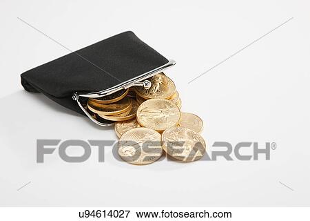 Stock Photo - Purse with golden coins, studio shot. Fotosearch
