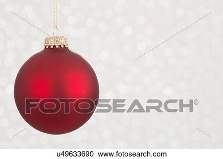 Stock Image - Red Christmas ornament on white background. Fotosearch