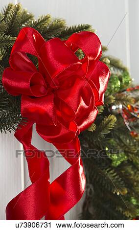 Red ribbon on Christmas wreath View Large Photo Image Stock Image - Red ribbon on Christmas wreath. Fotosearch