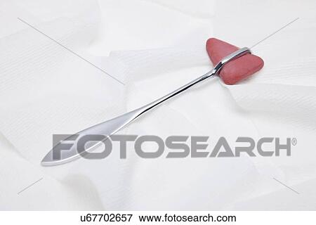 Stock Photo - Reflex hammer on white background, studio shot. Fotosearch