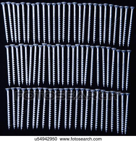 Stock Image - Rows of screws. Fotosearch