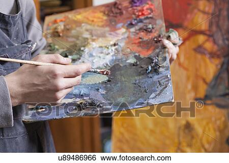 Russia, Voronezh, close-up of man holding color palette View Large Photo Image Stock Photograph - Russia, Voronezh, close-up of man holding color palette. Fotosearch