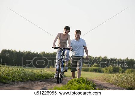 Stock Photography - Russia, Voronezh, couple on dirt road. Fotosearch