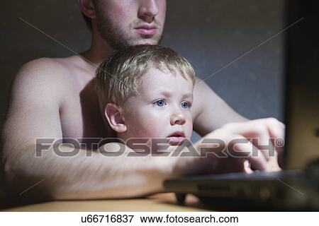 Russia, Voronezh, father and son (2-3) using computer View Large Photo Image Stock Photo - Russia, Voronezh, father and son (2-3) using computer. Fotosearch