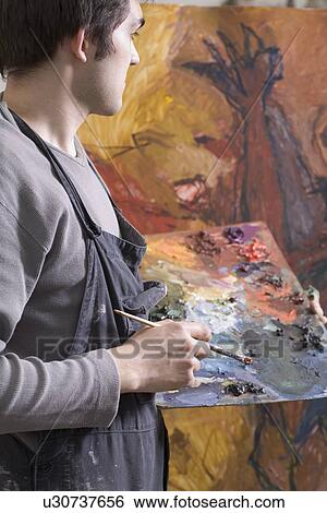 Russia, Voronezh, painter holding color palette View Large Photo Image Stock Photograph - Russia, Voronezh, painter holding color palette. Fotosearch