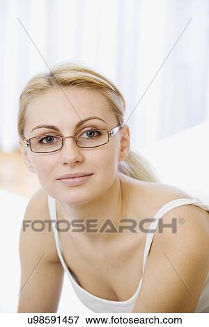 Stock Photo - Russia, Voronezh, Portrait of smiling young woman. Fotosearch