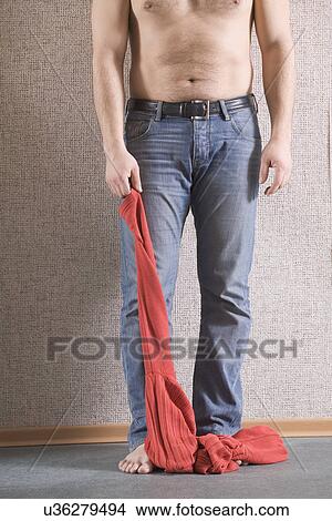 Russia, Voronezh, Shirtless man holding sweater, low section View Large Photo Image Picture - Russia, Voronezh, Shirtless man holding sweater, low section. Fotosearch