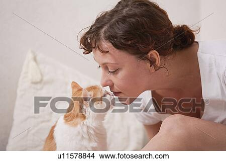 Russia, Voronezh, woman and cat rubbing noses View Large Photo Image Picture - Russia, Voronezh, woman and cat rubbing noses. Fotosearch