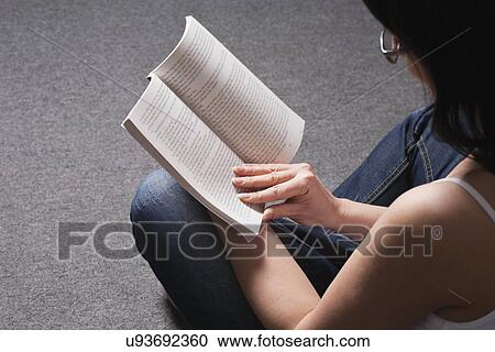 Russia, Voronezh, woman sitting on floor reading book View Large Photo Image Stock Image - Russia, Voronezh, woman sitting on floor reading book. Fotosearch