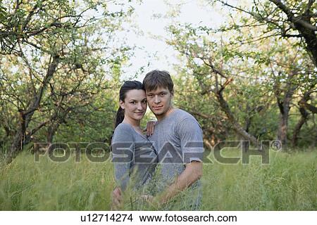 Russia, Voronezh, young couple in orchard View Large Photo Image Picture - Russia, Voronezh, young couple in orchard. Fotosearch
