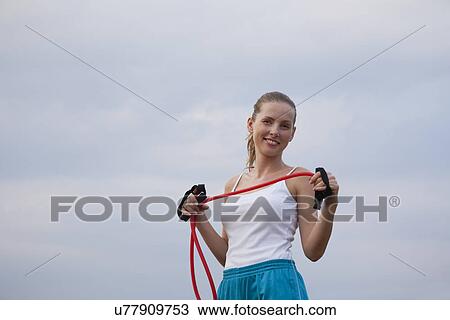 Stock Image - Russia, Voronezh, young woman exercising. Fotosearch