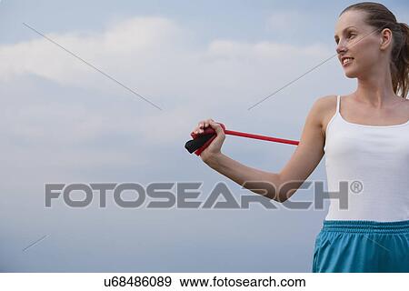 Stock Photo - Russia, Voronezh, young woman exercising. Fotosearch