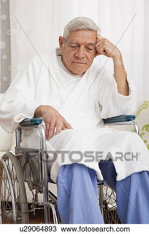 Stock Image - Sad senior man on wheelchair. Fotosearch